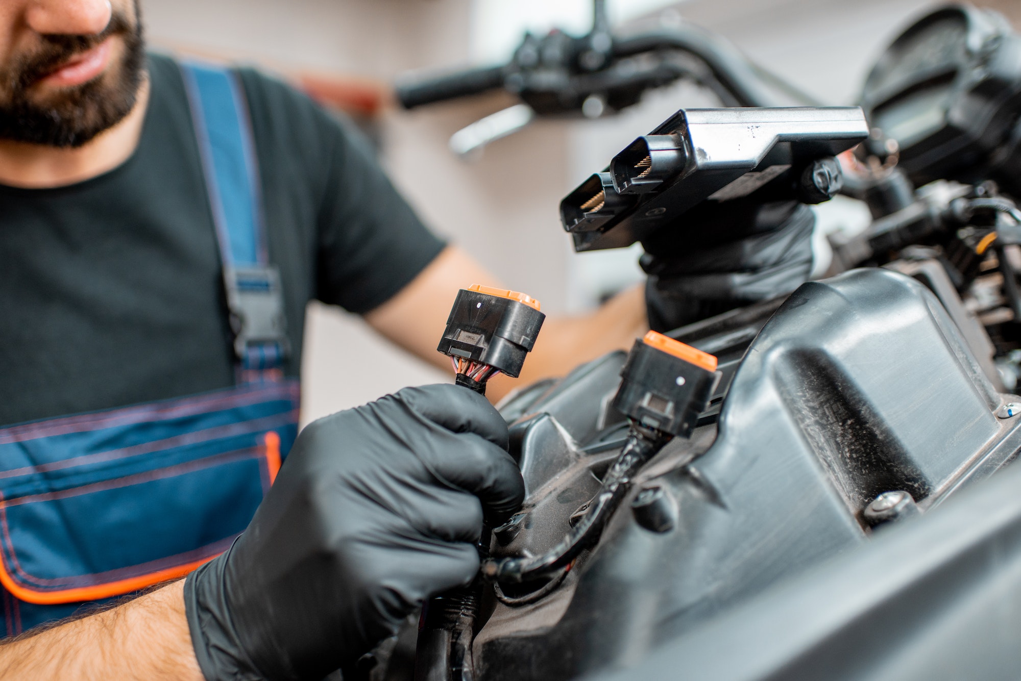 Electrician repairing motorcycle wiring